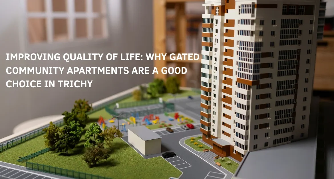 Model of a modern high-rise gated community apartment complex with landscaped greenery, parking area, and playground, representing quality living in Trichy.